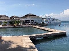 18A The outdoor restaurant and bar with a tour boat beyond at Grand Port Royal Hotel Marina Kingston Jamaica
